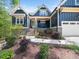 Craftsman-style home with stone accents and a well-manicured front yard at 104 Blue Finch Ct, Youngsville, NC 27596