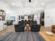 Open concept living area features hardwood floors, stylish furniture, and kitchen views at 104 Blue Finch Ct, Youngsville, NC 27596