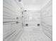 Modern shower design featuring marble tile walls, mosaic tile flooring, and sleek fixtures at 104 Blue Finch Ct, Youngsville, NC 27596
