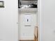 A convenient storage closet with shelving and media equipment at 104 Blue Finch Ct, Youngsville, NC 27596