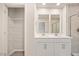 The bathroom boasts a double sink vanity, tile floors and a walk in closet at 1048 Winding Spring Dr, Mebane, NC 27302