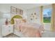 Bright bedroom featuring large window, stylish decor, and plush carpet at 1048 Winding Spring Dr, Mebane, NC 27302