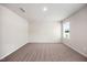 Bedroom with neutral carpet, windows with views and an overhead light at 1048 Winding Spring Dr, Mebane, NC 27302