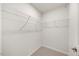 Corner closet with wire shelving and carpeted floor at 1048 Winding Spring Dr, Mebane, NC 27302