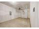 Spacious two car garage with concrete floor and finished walls at 1048 Winding Spring Dr, Mebane, NC 27302