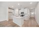 Modern kitchen featuring an island with bar seating and stainless steel appliances at 1048 Winding Spring Dr, Mebane, NC 27302