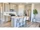 Modern kitchen with stainless steel appliances, an island, and quartz countertops at 1048 Winding Spring Dr, Mebane, NC 27302
