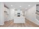 Modern kitchen featuring white cabinets, stone countertops, and stainless steel appliances at 1048 Winding Spring Dr, Mebane, NC 27302