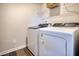 Laundry room featuring a white, side-by-side washer and dryer at 1048 Winding Spring Dr, Mebane, NC 27302