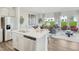 Open concept living space features an island, stainless steel appliances, and lots of natural light at 1048 Winding Spring Dr, Mebane, NC 27302