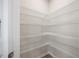 Walk-in pantry with wire shelving and an abundance of storage space at 1048 Winding Spring Dr, Mebane, NC 27302