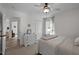 Bedroom with white walls and carpet, featuring a door that leads to another room at 108 Ruff Davis Rd, Roxboro, NC 27574