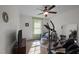 Bedroom with a ceiling fan, tv, and exercise equipment at 108 Ruff Davis Rd, Roxboro, NC 27574