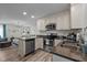 Well-equipped kitchen with stainless steel appliances, sleek granite countertops, and ample storage, seamlessly connected to the living area at 108 Ruff Davis Rd, Roxboro, NC 27574