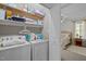 Laundry room featuring a washer and dryer and wire shelving for storage at 108 Ruff Davis Rd, Roxboro, NC 27574