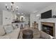 Bright and airy living room with a fireplace, seamlessly connected to the kitchen, creating a modern and inviting living space at 108 Ruff Davis Rd, Roxboro, NC 27574