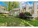 Backyard and patio area boasts beautiful lawn and shrubbery at 108 Woodglen Dr, Cary, NC 27518