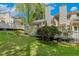 Spacious backyard features a lush lawn and mature trees at 108 Woodglen Dr, Cary, NC 27518