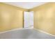 Bedroom with bright yellow walls and a doorway leading to another room at 108 Woodglen Dr, Cary, NC 27518