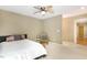 Bedroom features a ceiling fan, a stylish chair, and view to the hallway at 108 Woodglen Dr, Cary, NC 27518