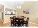 Open dining area featuring modern lighting and views to the kitchen at 108 Woodglen Dr, Cary, NC 27518