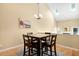 Light-filled dining area with high ceilings and natural wood floors at 108 Woodglen Dr, Cary, NC 27518