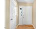 Hallway with white trim and hardwood floors at 108 Woodglen Dr, Cary, NC 27518