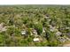 An aerial view of the neighborhood shows lush greenery and charming homes nestled among the trees at 109 N Hassel St, Hillsborough, NC 27278