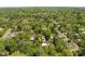 Aerial view of a neighborhood surrounded by lush trees, showcasing the serene community at 109 N Hassel St, Hillsborough, NC 27278