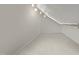 Spacious attic room with carpet flooring, and lighting at 109 N Hassel St, Hillsborough, NC 27278