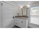 Bathroom featuring modern vanity, granite countertop, modern mirror and light fixtures, and a window at 109 N Hassel St, Hillsborough, NC 27278