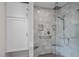Bathroom featuring tiled shower with rainfall showerhead and built in bench at 109 N Hassel St, Hillsborough, NC 27278