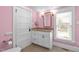 Bathroom featuring pink walls, white cabinets and trim, granite countertop, and tile flooring at 109 N Hassel St, Hillsborough, NC 27278