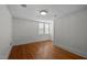 Bedroom with hardwood floors, classic millwork and light-filled windows at 109 N Hassel St, Hillsborough, NC 27278