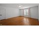 Simple yet elegant bedroom with hardwood floors, neutral walls, and ample natural light at 109 N Hassel St, Hillsborough, NC 27278