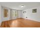 Bright bedroom with hardwood floors, white walls and trim, and a large window at 109 N Hassel St, Hillsborough, NC 27278