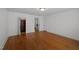 Bright bedroom with hardwood floors, white walls, multiple closets, and natural light at 109 N Hassel St, Hillsborough, NC 27278