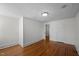 Large bedroom with hardwood floors and multiple doorways at 109 N Hassel St, Hillsborough, NC 27278