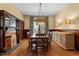 Spacious dining room featuring hardwood floors, wooden table, and natural lighting at 109 N Hassel St, Hillsborough, NC 27278