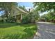 Charming home with inviting front porch, lush lawn, mature trees, and a long gravel driveway at 109 N Hassel St, Hillsborough, NC 27278