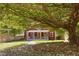 Quaint red home with a covered front porch and stone pathway leading to the entrance at 109 N Hassel St, Hillsborough, NC 27278