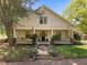Inviting two-story home featuring a wide porch with classic columns and well-manicured landscaping at 109 N Hassel St, Hillsborough, NC 27278