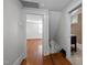 Hallway featuring hardwood floors with access to bedroom and bathroom at 109 N Hassel St, Hillsborough, NC 27278