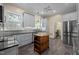 Bright kitchen boasts stainless appliances, modern cabinets, granite countertops and a moveable island at 109 N Hassel St, Hillsborough, NC 27278