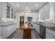 Charming kitchen features modern cabinets, stainless appliances, granite countertops and an island at 109 N Hassel St, Hillsborough, NC 27278