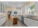 Modern kitchen with stainless steel appliances, granite countertops, and center island at 109 N Hassel St, Hillsborough, NC 27278