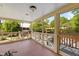 Charming screened porch with wood flooring and a view of the backyard at 109 N Hassel St, Hillsborough, NC 27278