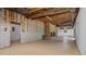Spacious unfinished basement includes brick fireplace, exposed ceiling and framing at 110 Omega Rd, Henderson, NC 27536