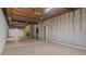 Spacious unfinished basement includes brick fireplace, exposed ceiling and framing at 110 Omega Rd, Henderson, NC 27536