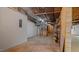 Unfinished basement includes exposed ceiling, white walls, and cement floors at 110 Omega Rd, Henderson, NC 27536